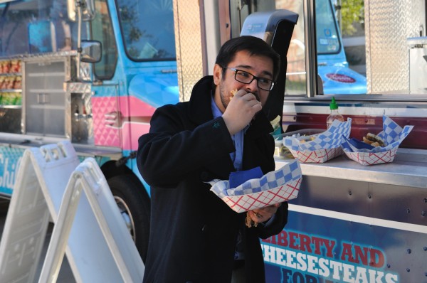 Thomas eating Cheesesteak
