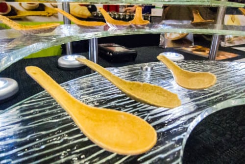 Edible spoons like these tasted like whole wheat crackers but come in dozens of flavors. These will be popular at big outdoor food festivals